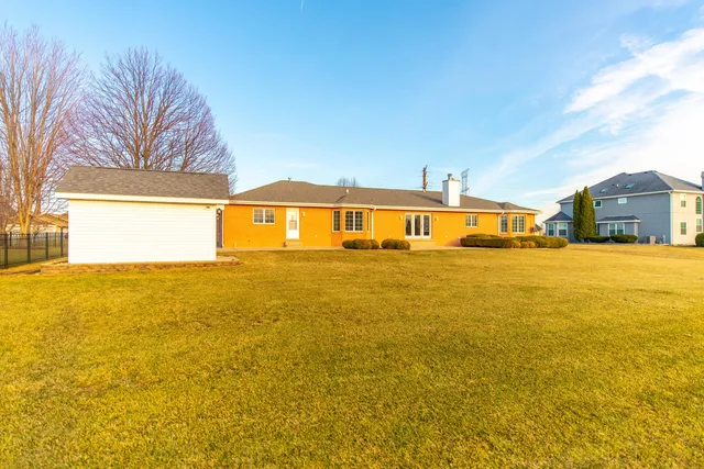 a view of a lake with houses in the back