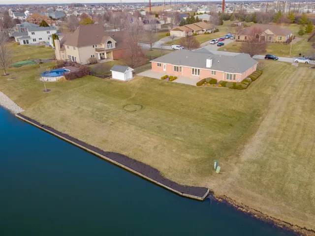 an aerial view of a house with a swimming pool