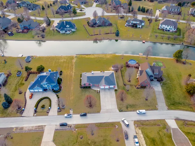 a spacious bedroom with a bed and a large window