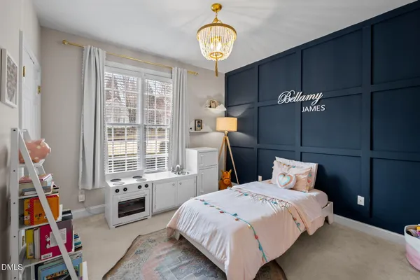 a bedroom with bed and a window