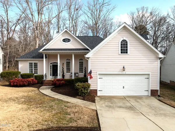 a front view of house with outdoor seating