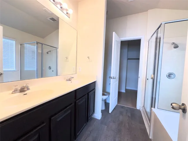 a view of a small space with wooden floor