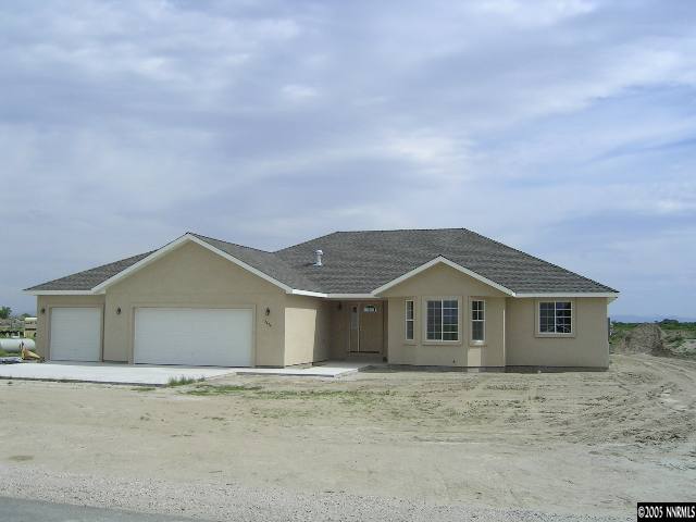 4439 Rancheria Road Fallon, NV 89406 - Photo 1 of 4 a front view of a house with a garden
