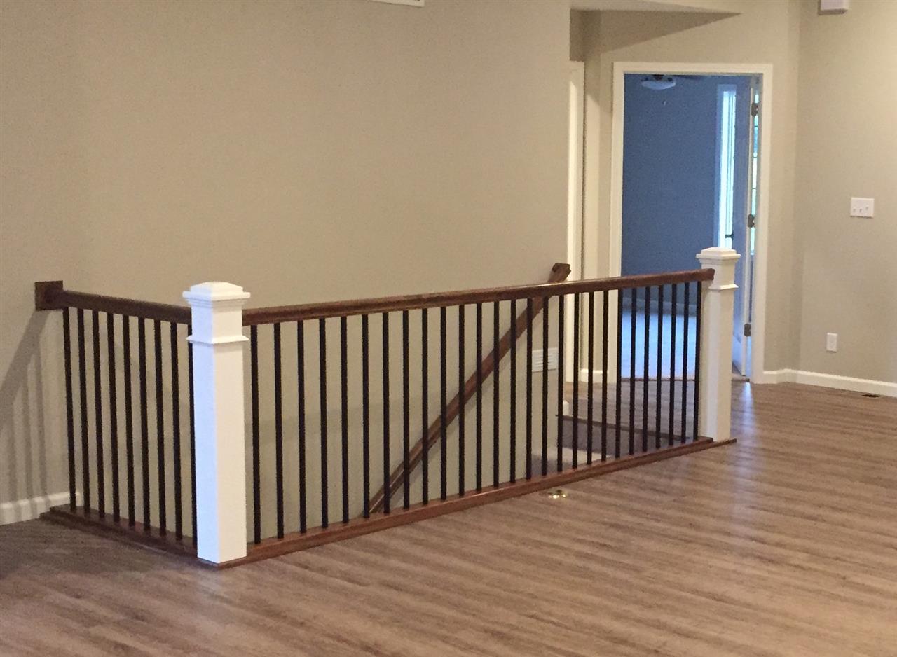 319 East Pershing Road Stillman Valley, IL 61084 - Photo 3 of 7 a view of a hallway with wooden floor