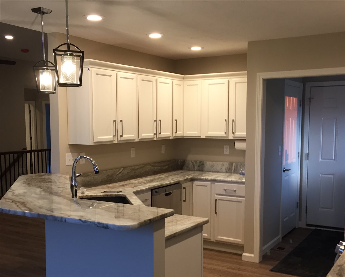 319 East Pershing Road Stillman Valley, IL 61084 - Photo 5 of 7 a kitchen with a sink and a refrigerator