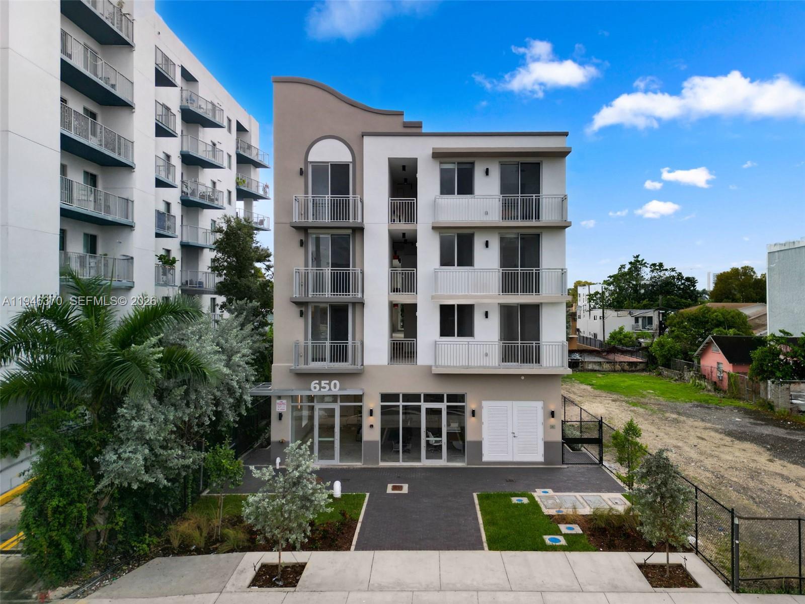 650 Southwest 1st Street, Unit 403 Miami, FL 33130 - Photo 9 of 13 a front view of a building with balcony