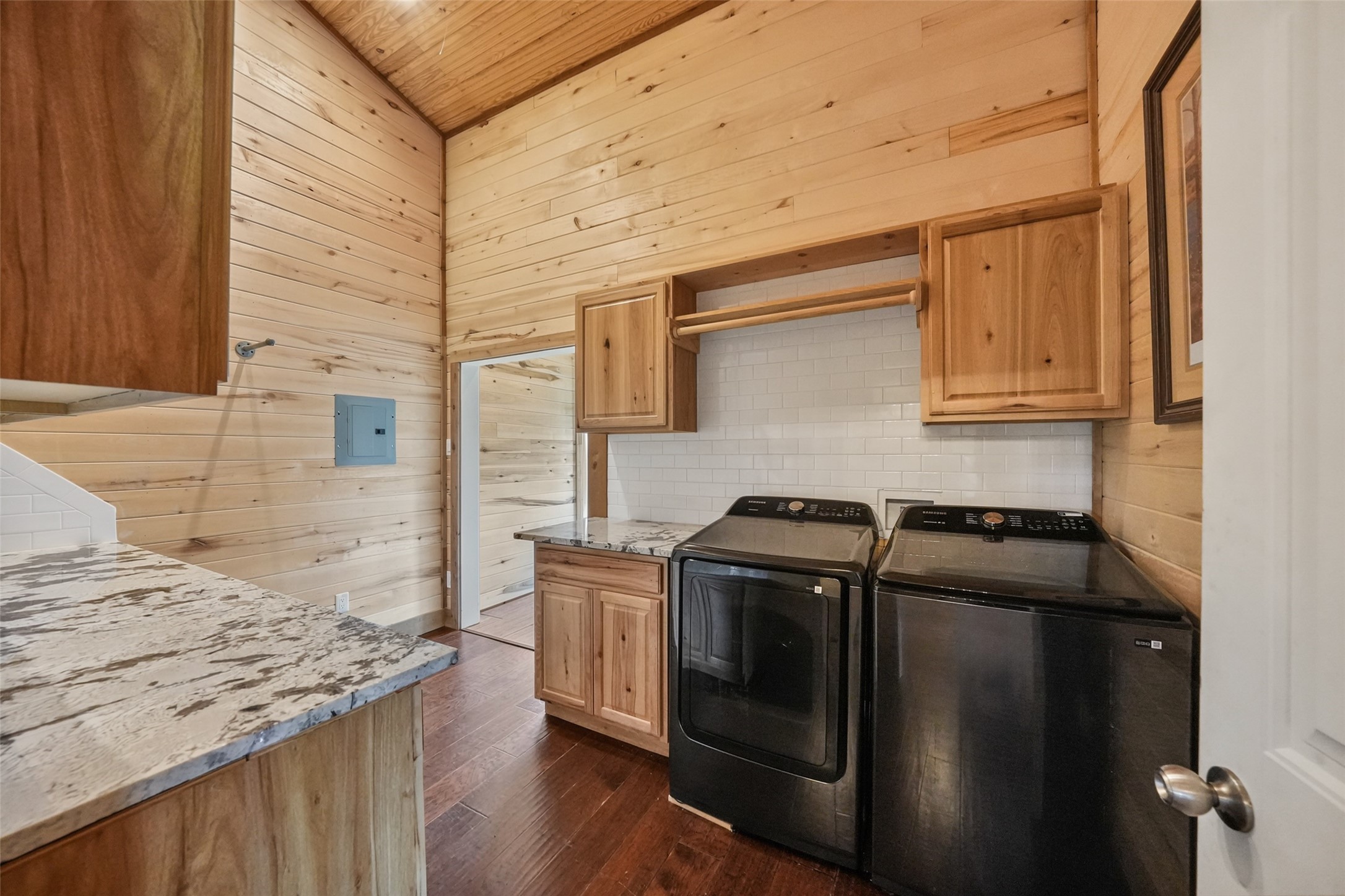 26534 Mitchell Road Hempstead, TX 77445 - Photo 28 of 45 a kitchen with granite countertop a stove and a wooden cabinets