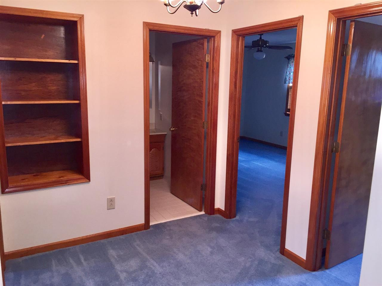 2693 Benson Hardee Road Benson, NC 27504 - Photo 20 of 25 Hallway with custom built-in shelving. This is near the cedar closet. Hallway