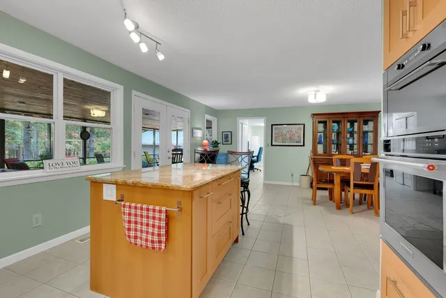 a bedroom with a bed and flat screen tv