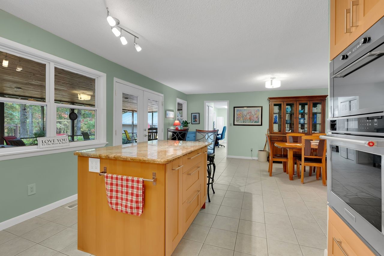 3711 Jumpoff Road Sewanee, TN 37375 - Photo 12 of 57 a large kitchen with stainless steel appliances granite countertop a large counter top and a stove