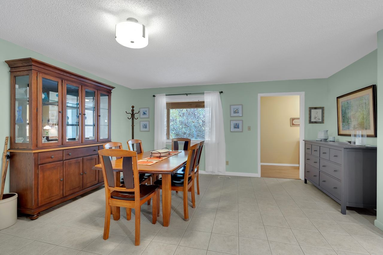 3711 Jumpoff Road Sewanee, TN 37375 - Photo 15 of 57 a view of a dining room with furniture window and wooden floor