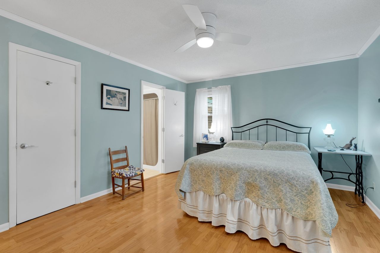 3711 Jumpoff Road Sewanee, TN 37375 - Photo 17 of 57 a bedroom with a bed and chair