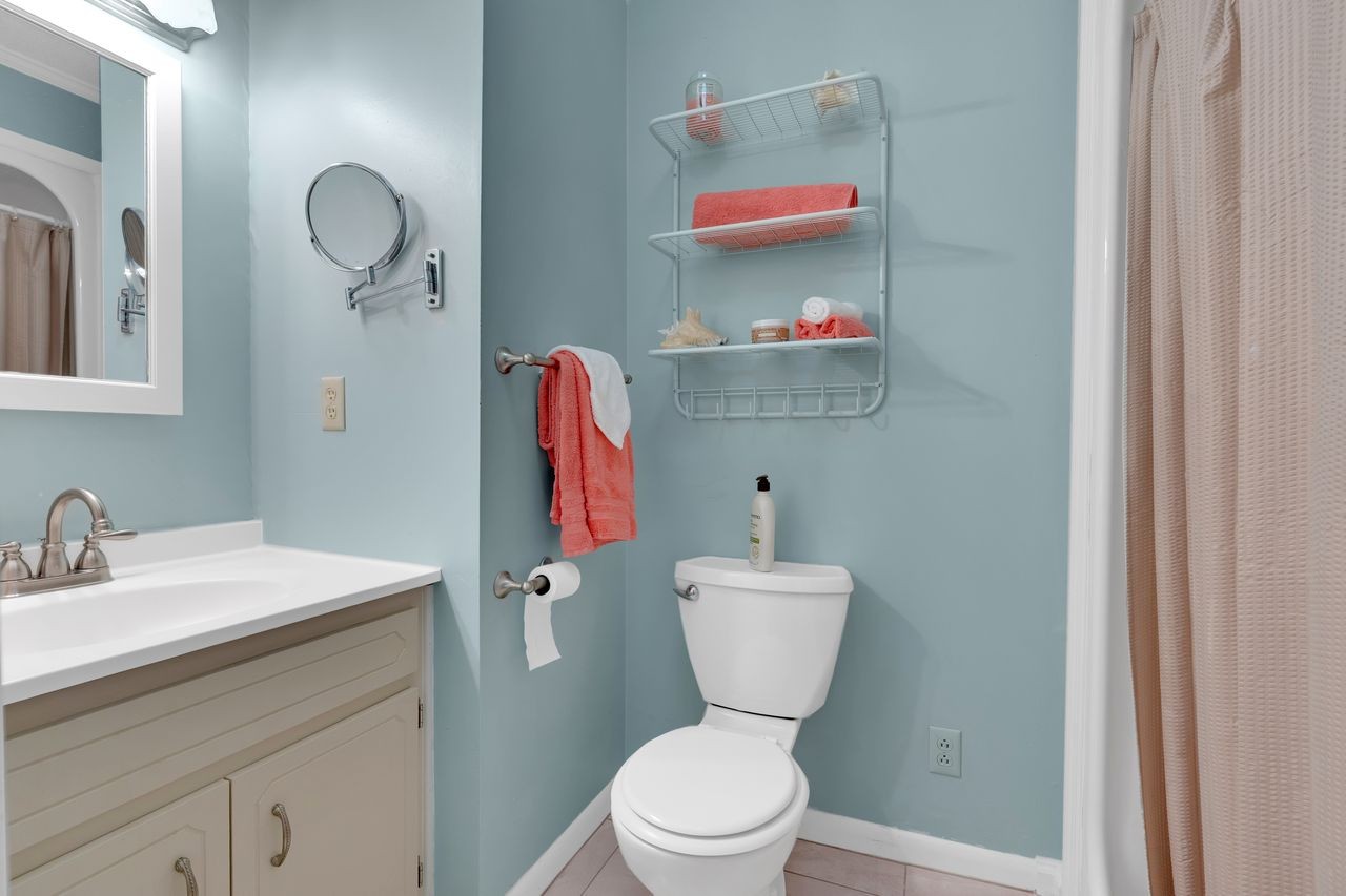 3711 Jumpoff Road Sewanee, TN 37375 - Photo 18 of 57 a bathroom with a sink vanity mirror and toilet