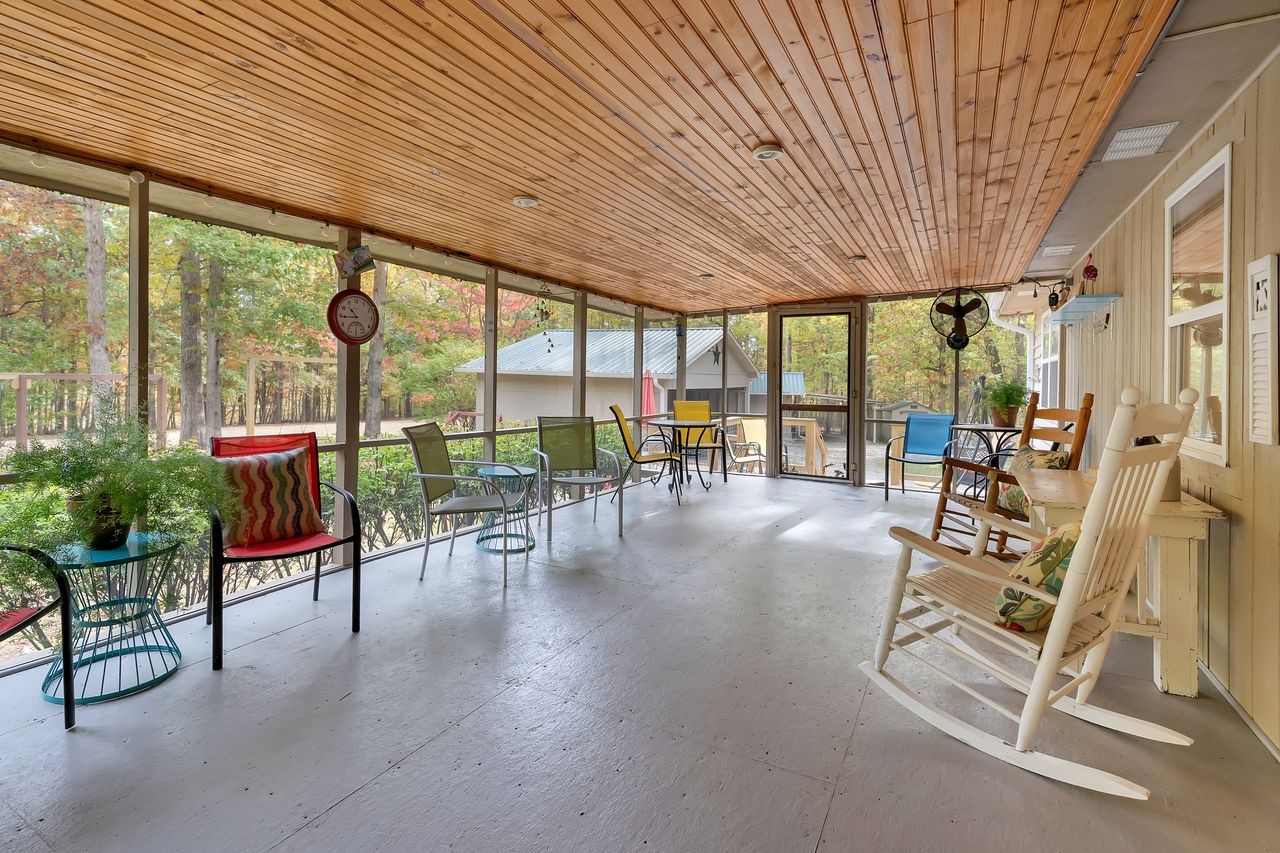 3711 Jumpoff Road Sewanee, TN 37375 - Photo 31 of 57 a living room with furniture and a floor to ceiling window
