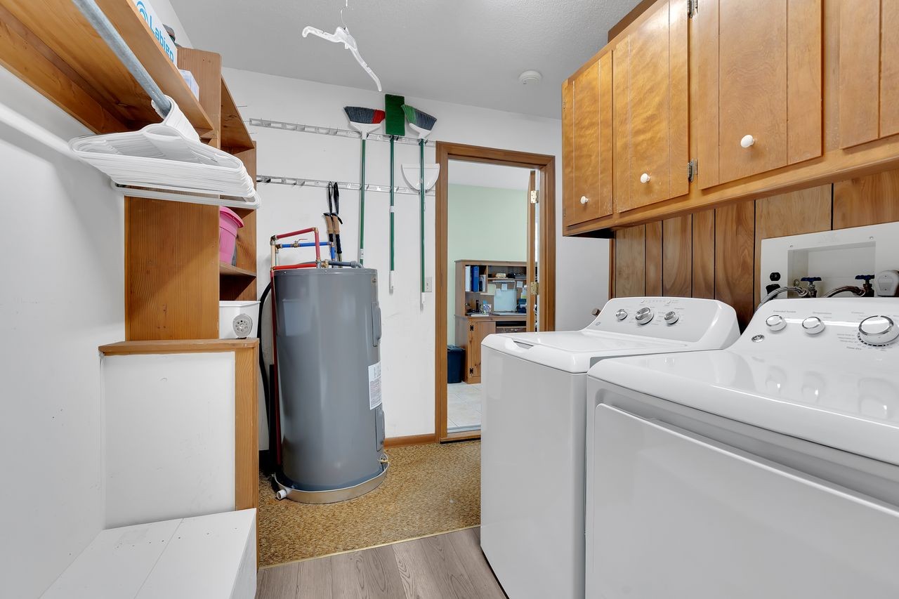 3711 Jumpoff Road Sewanee, TN 37375 - Photo 33 of 57 a view of storage and utility room with washer and dryer