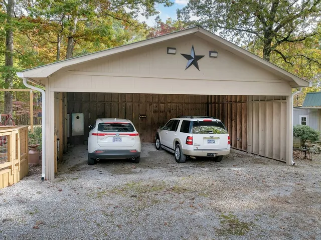 a view of a yard with large trees