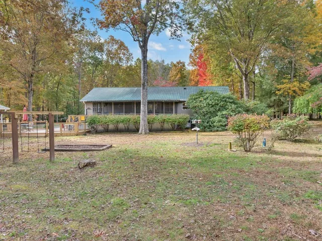 a backyard of a house with lots of green space