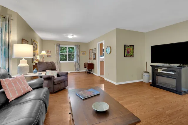 a large kitchen with stainless steel appliances granite countertop a large counter top and a stove