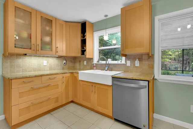 a spacious bedroom with a bed and cabinets