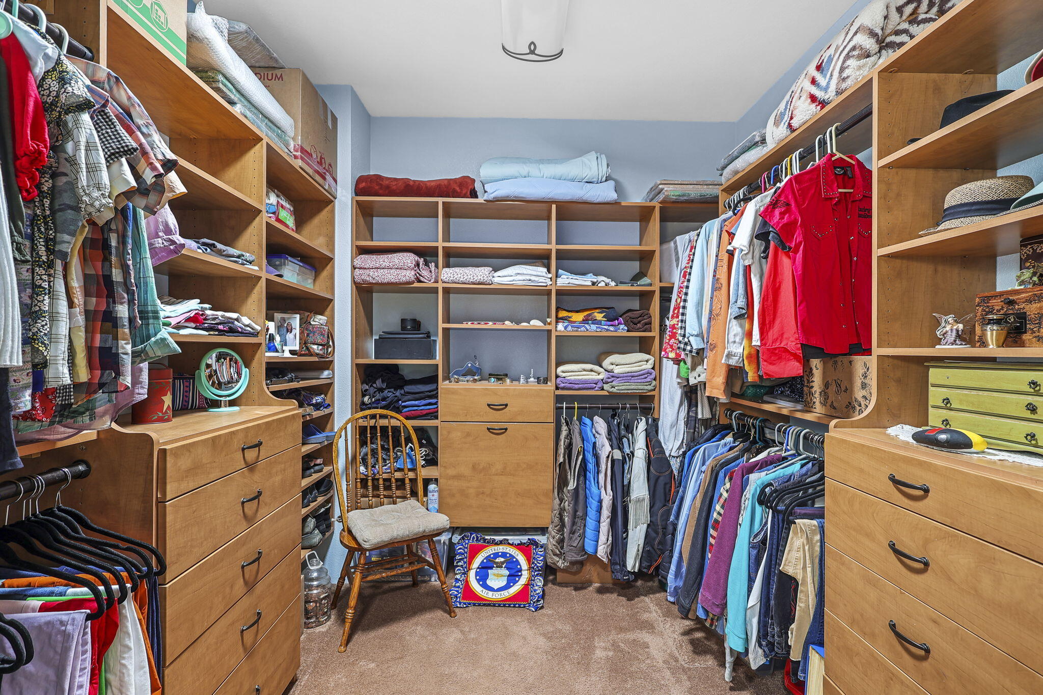 14703 Fern Road Whitmore, CA 96096 - Photo 9 of 48 a view of walk in closet with clothes and shoes