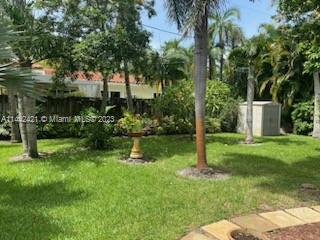 2060 Northeast 26th Street Lighthouse Point, FL 33064 - Photo 22 of 24 a garden with plants and palm trees