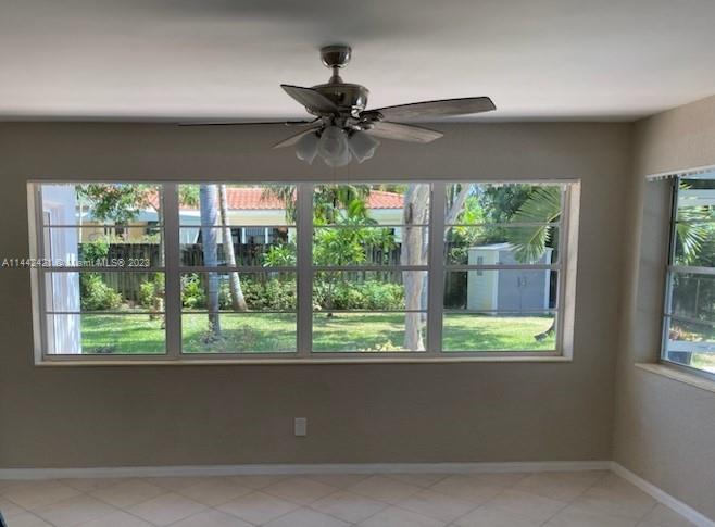 2060 Northeast 26th Street Lighthouse Point, FL 33064 - Photo 7 of 24 a view of a livingroom with a ceiling fan and a window