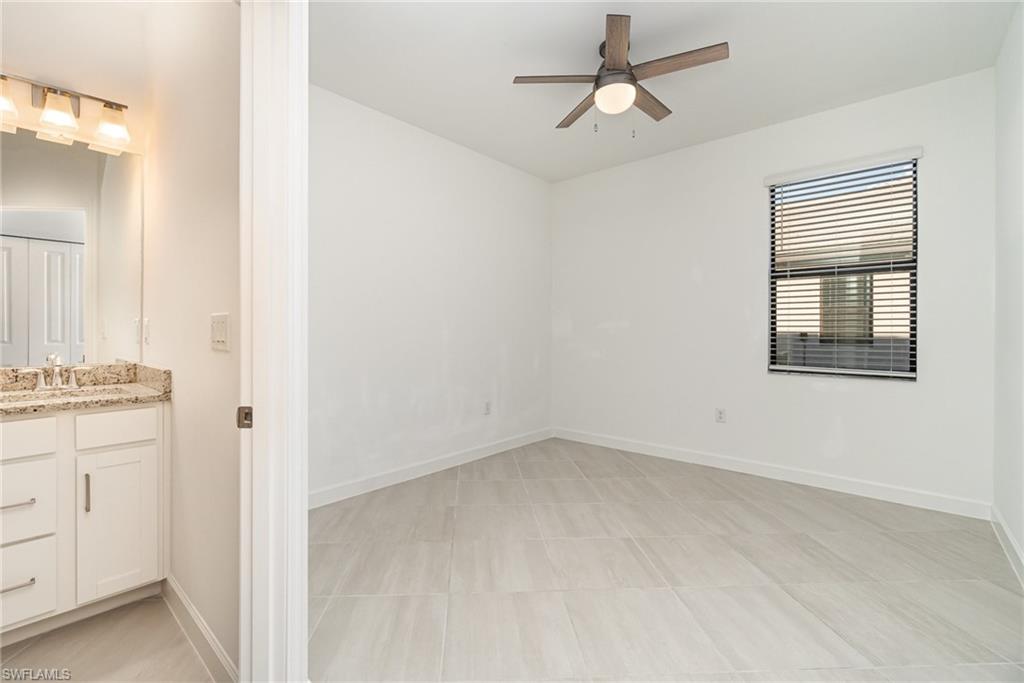 11127 Canopy Loop Fort Myers, FL 33913 - Photo 10 of 29 Spare room with baseboards and a ceiling fan