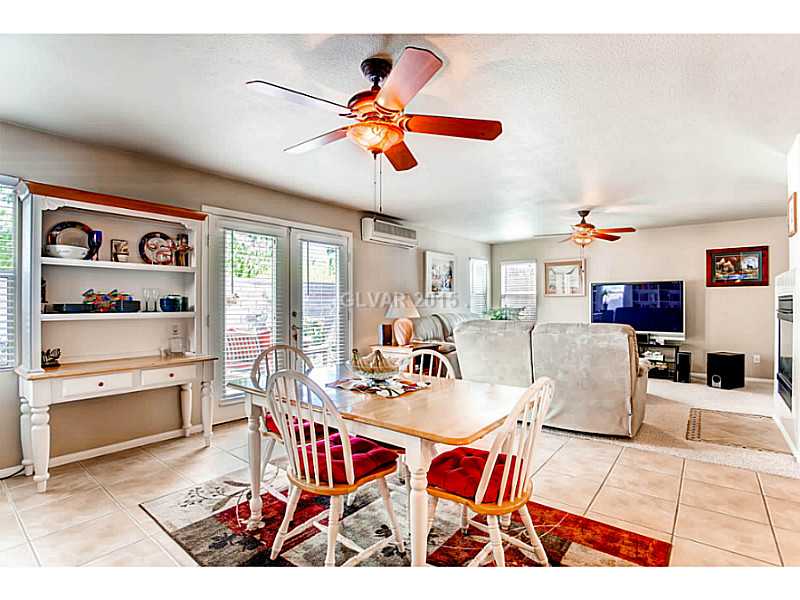 936 Midpride Street Las Vegas, NV 89144 - Photo 14 of 33 Kitchen. View of family room from dining are of kitchen. 3rd HVAC unit for addition too!