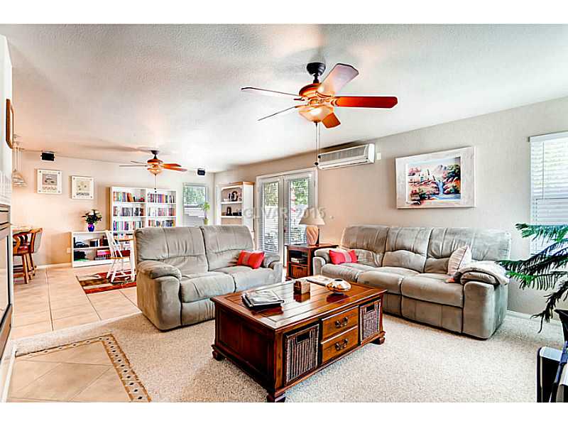 936 Midpride Street Las Vegas, NV 89144 - Photo 16 of 33 Family Room. Shares a dual sided fireplace with the dining room