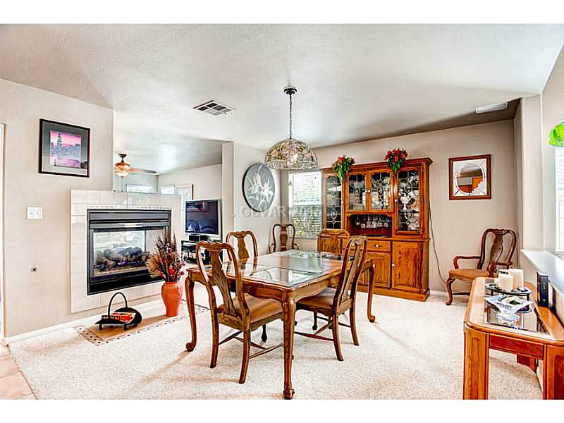 936 Midpride Street Las Vegas, NV 89144 - Photo 6 of 33 Dining Room. Very large room with a fireplace
