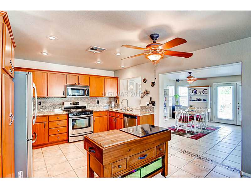 936 Midpride Street Las Vegas, NV 89144 - Photo 8 of 33 Kitchen. Remodeled kitchen with Granite counters and beautiful backsplash