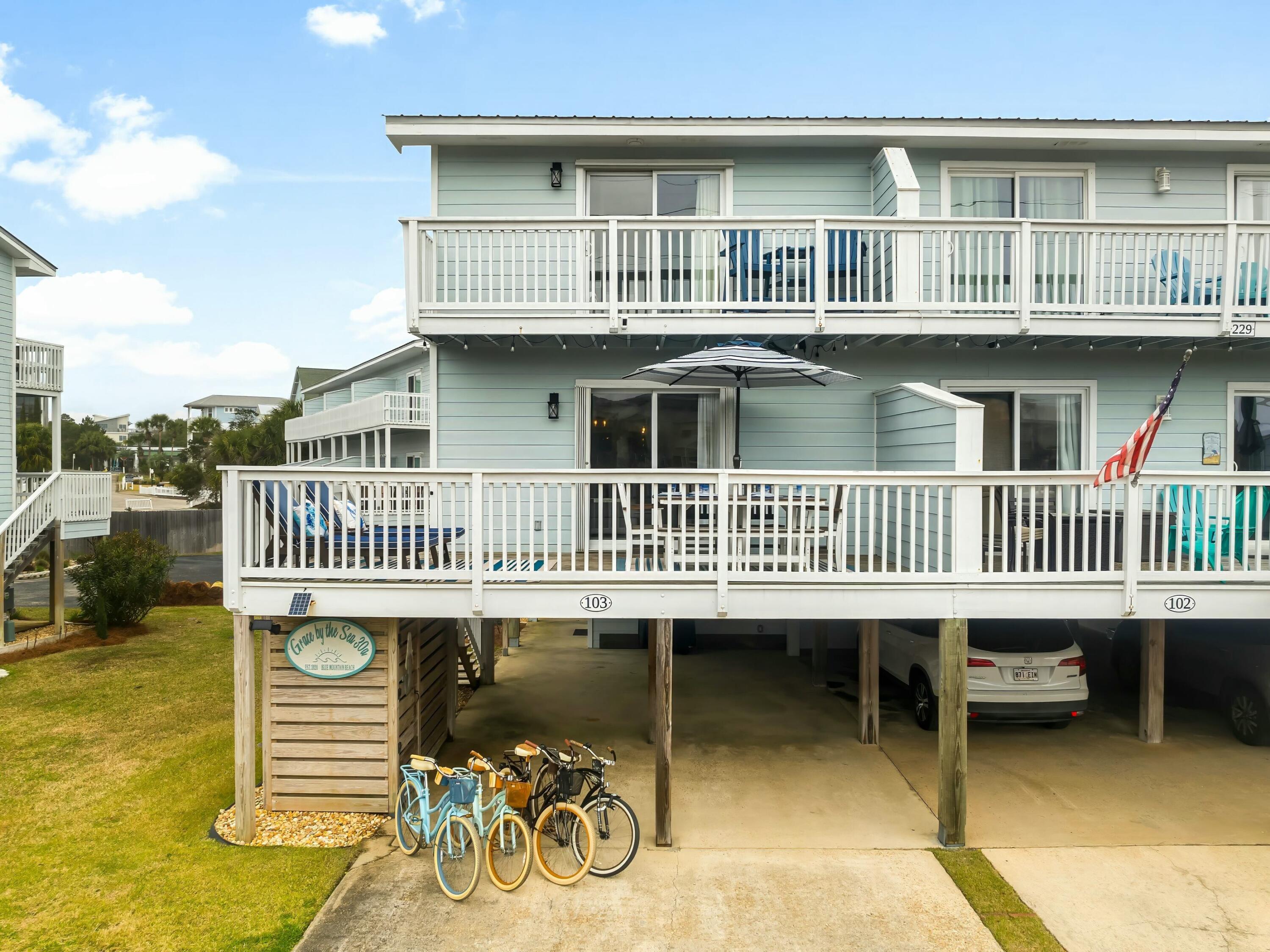 229 Blue Mountain Road, Unit 103 Santa Rosa Beach, FL 32459 - Photo 4 of 50 a view of a house with a deck