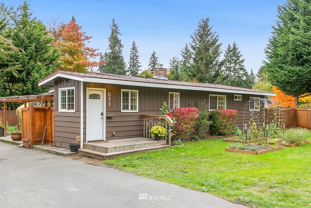 631 219th Place Southwest Bothell, WA 98021 - Photo 1 of 21 a front view of house with yard and green space