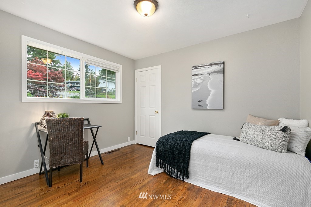 631 219th Place Southwest Bothell, WA 98021 - Photo 12 of 21 a bedroom with a bed and a chair