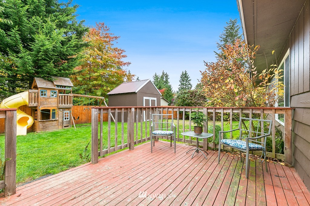 631 219th Place Southwest Bothell, WA 98021 - Photo 15 of 21 a view of a house with wooden deck