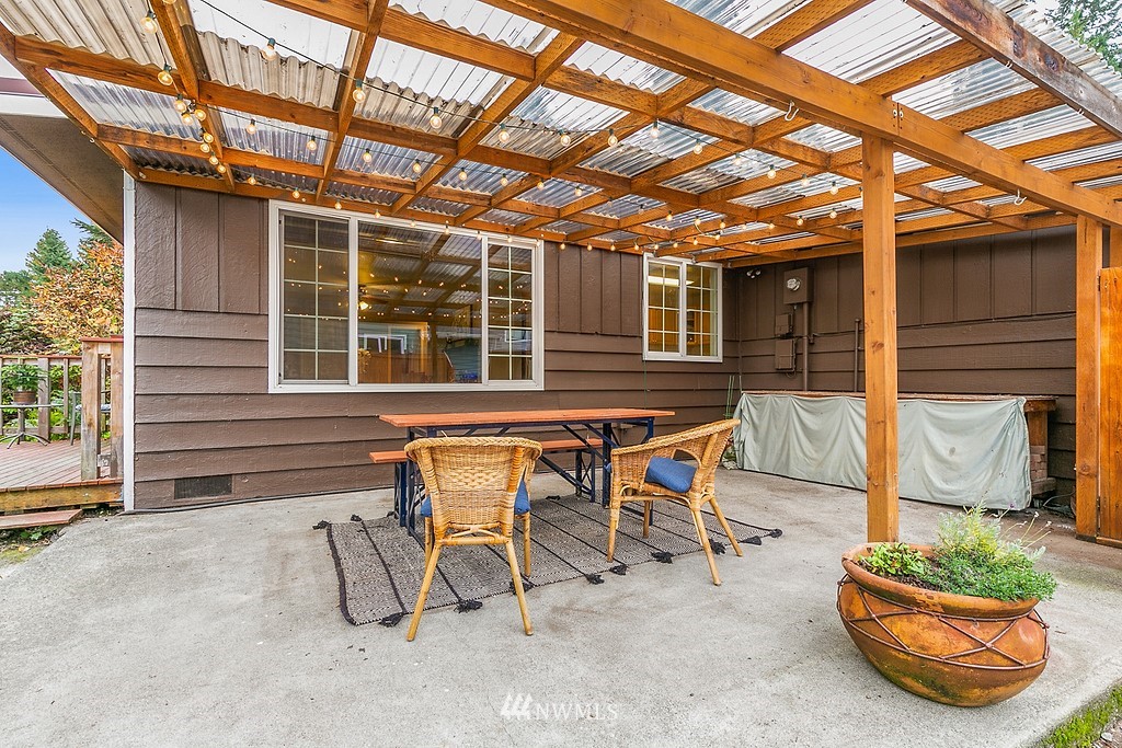 631 219th Place Southwest Bothell, WA 98021 - Photo 18 of 21 a backyard of a house with table and chairs