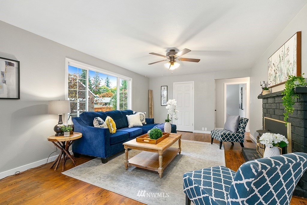 631 219th Place Southwest Bothell, WA 98021 - Photo 5 of 21 a living room with furniture a rug and a window