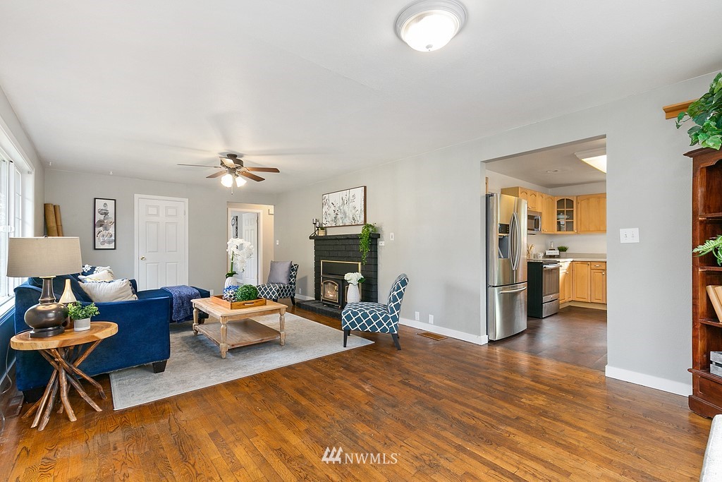 631 219th Place Southwest Bothell, WA 98021 - Photo 6 of 21 a living room with furniture and a fireplace