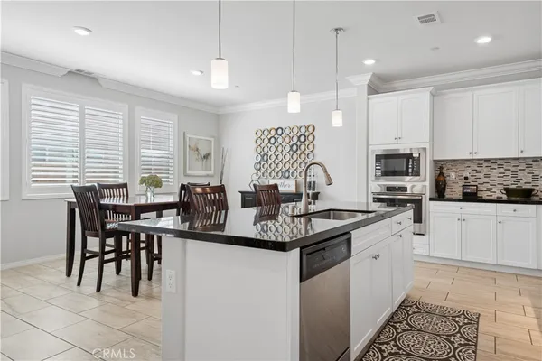 a kitchen with lots of counter space sink and appliances