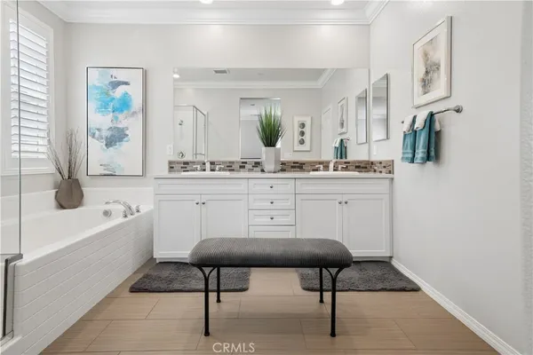 a kitchen with cabinets and chair
