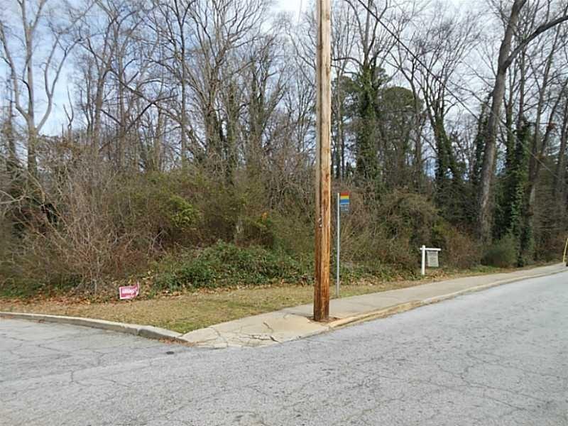 1919 Virginia Avenue Atlanta, GA 30337 - Photo 1 of 3 a backyard of a house with trees