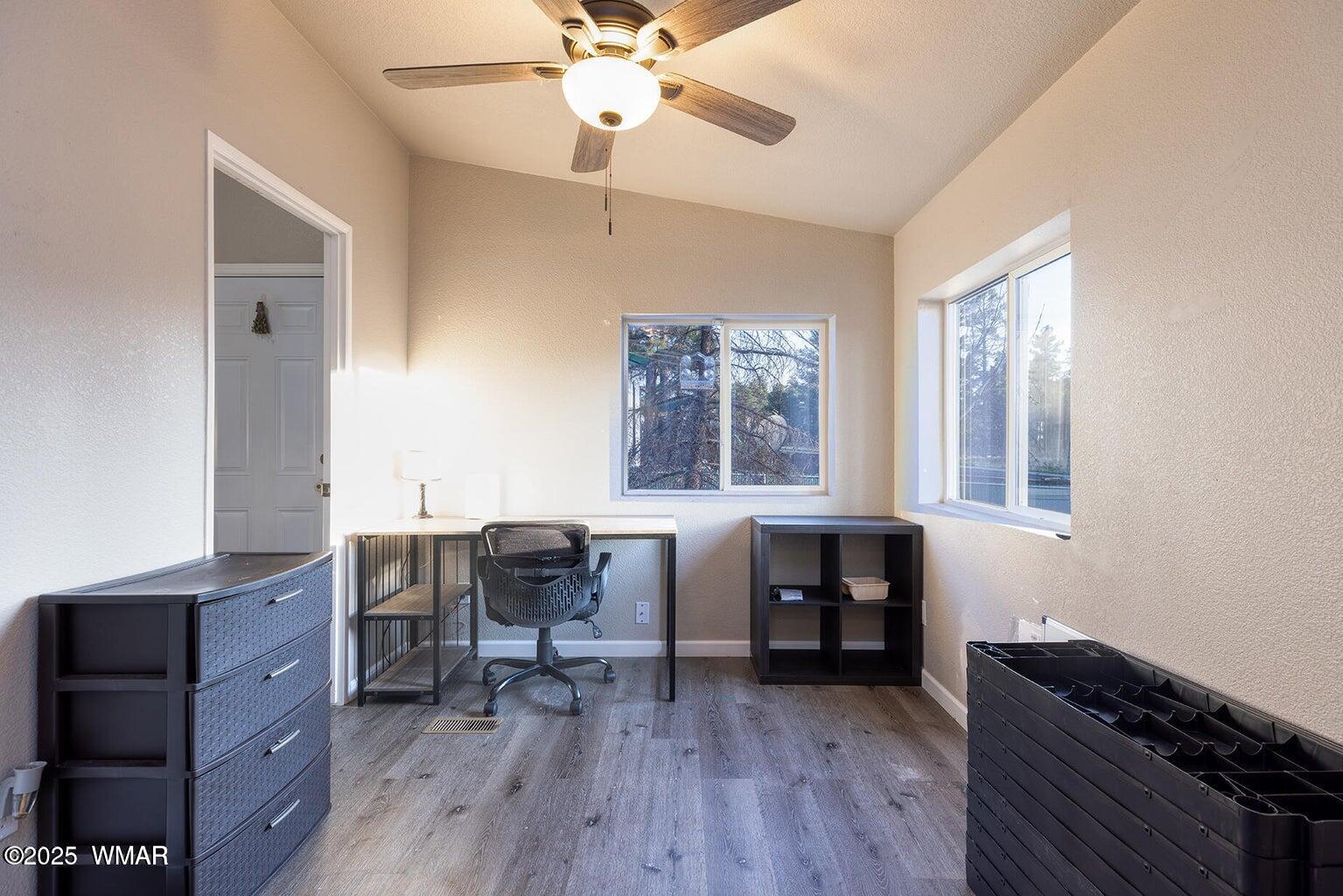 430 Timber Ridge Loop Show Low, AZ 85901 - Photo 13 of 27 a view of a workspace with furniture and a window