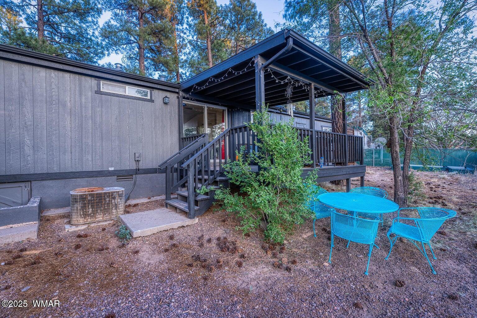 430 Timber Ridge Loop Show Low, AZ 85901 - Photo 17 of 27 a backyard of a house with table and chairs
