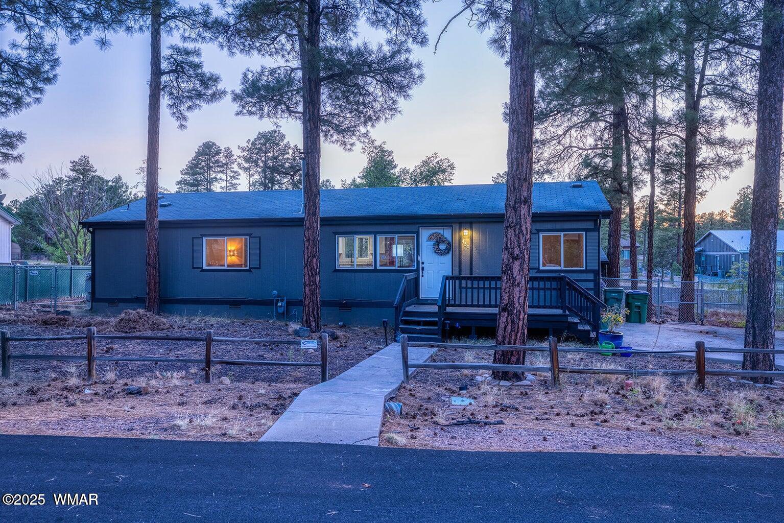 430 Timber Ridge Loop Show Low, AZ 85901 - Photo 23 of 27 a front view of a house with garden