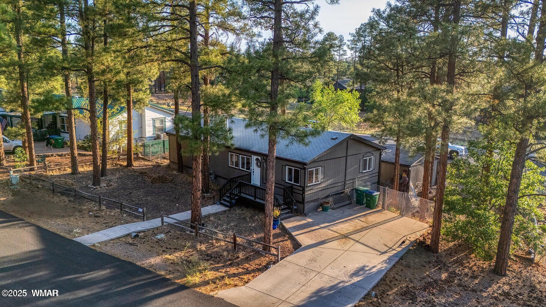 430 Timber Ridge Loop Show Low, AZ 85901 - Photo 24 of 27 a view of a house with a yard balcony and tree
