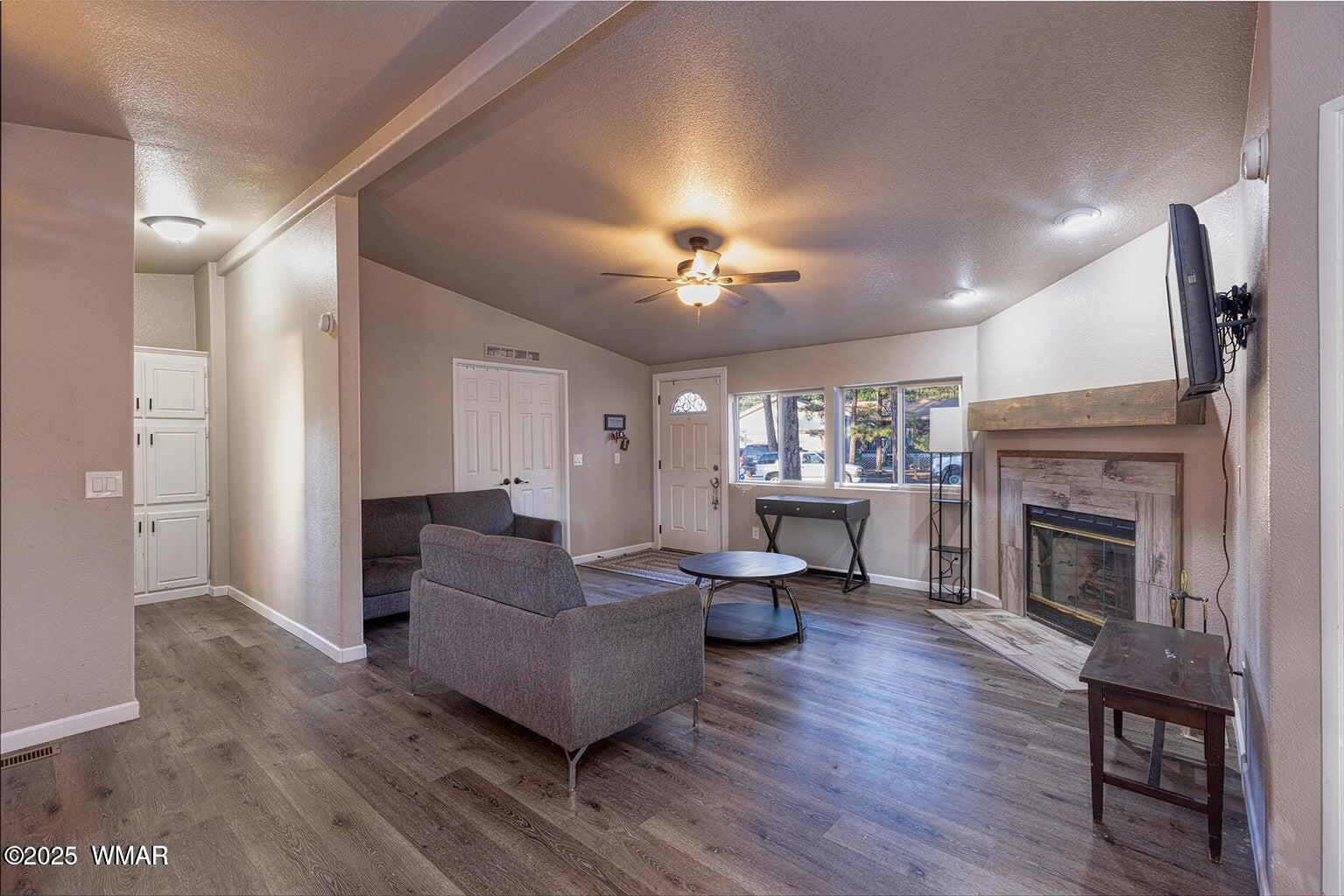 430 Timber Ridge Loop Show Low, AZ 85901 - Photo 4 of 27 a living room with furniture and a fireplace