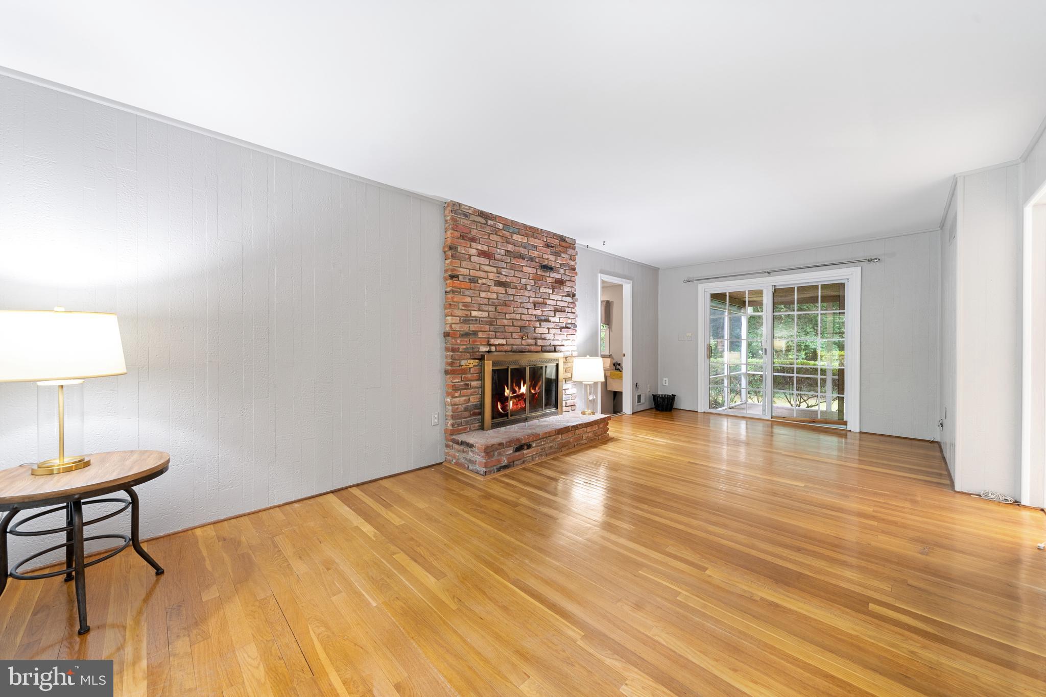1643 Homewood Road Annapolis, MD 21409 - Photo 15 of 59 a view of empty room with wooden floor and fireplace