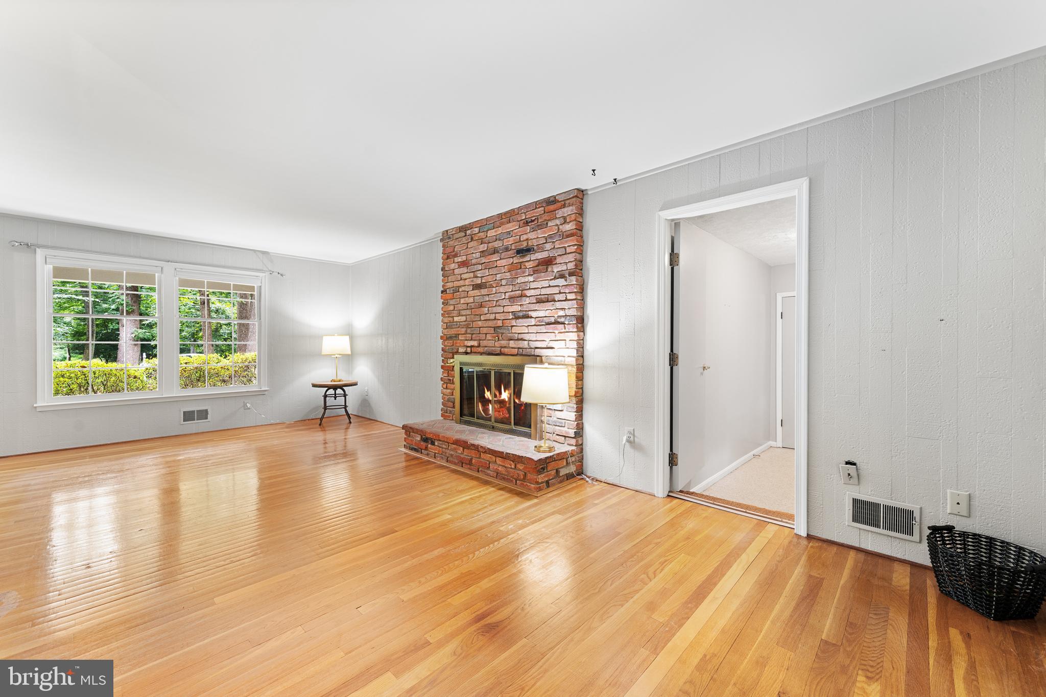 1643 Homewood Road Annapolis, MD 21409 - Photo 17 of 59 a view of a livingroom with wooden floor and a fireplace