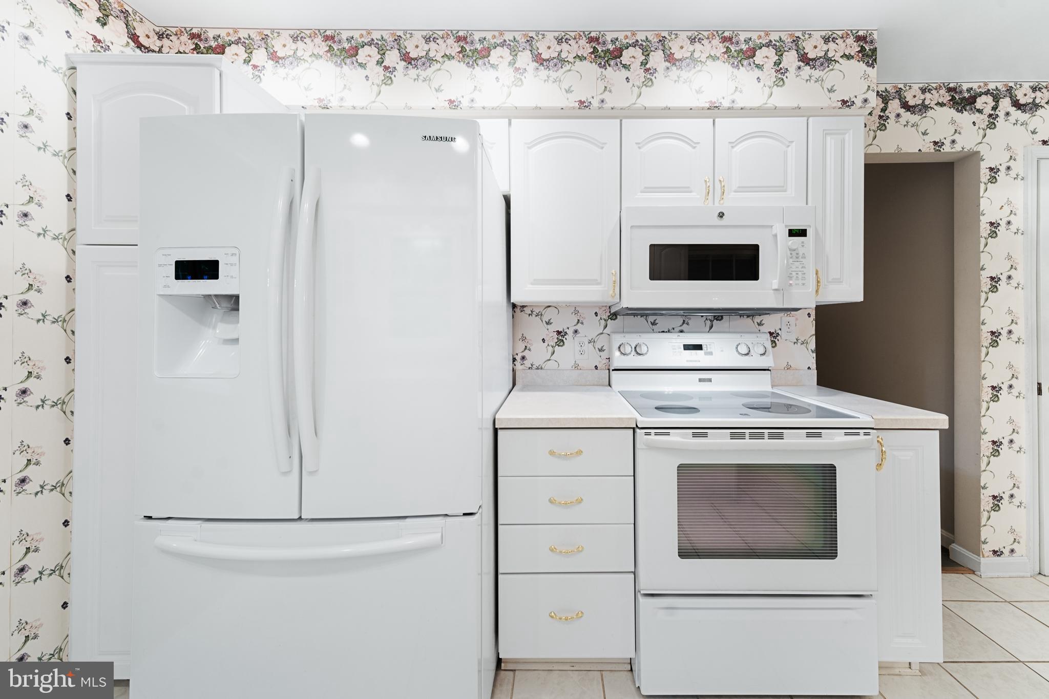 1643 Homewood Road Annapolis, MD 21409 - Photo 21 of 59 a kitchen with stainless steel appliances a stove microwave and refrigerator