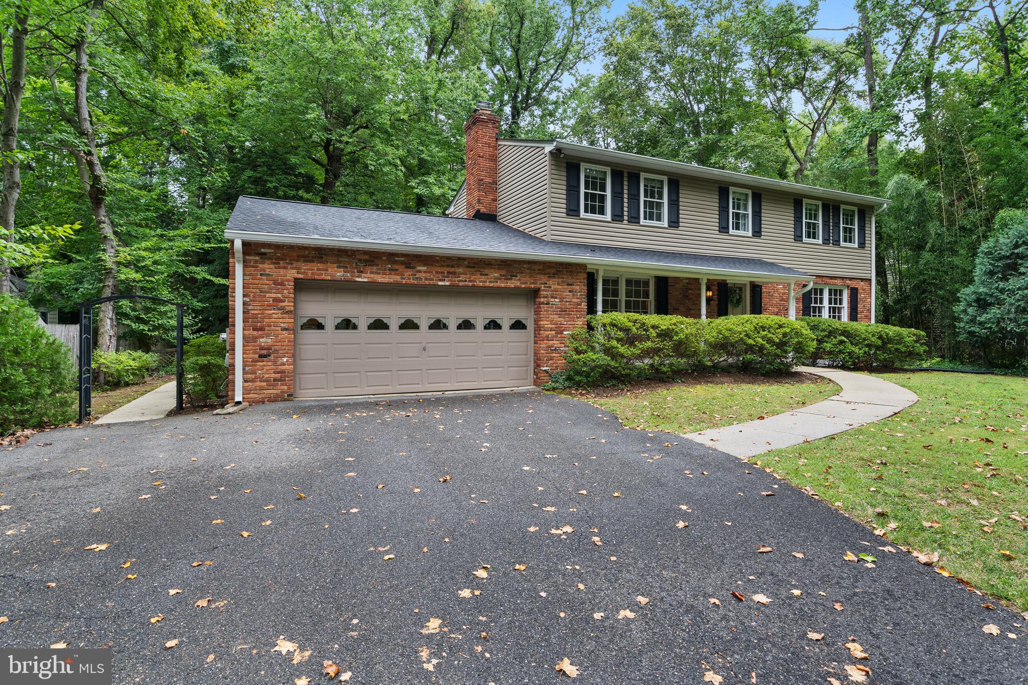 1643 Homewood Road Annapolis, MD 21409 - Photo 3 of 59 a front view of a house with a yard and garage
